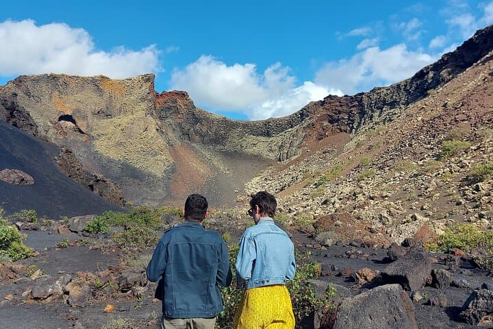 Trekking in the Volcanoes Natural Park in a small group photo 2