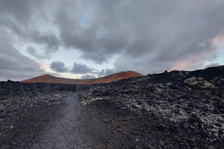 Trekking in the Volcanoes Natural Park in a small group photo 3