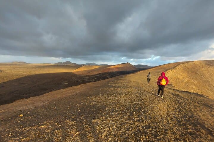 Trekking in the Volcanoes Natural Park in a small group photo 4